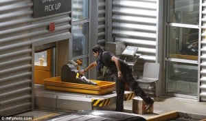 Zayn Picking Up His Guitar at the airport